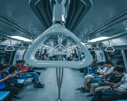 People using public transportation in a busy city setting